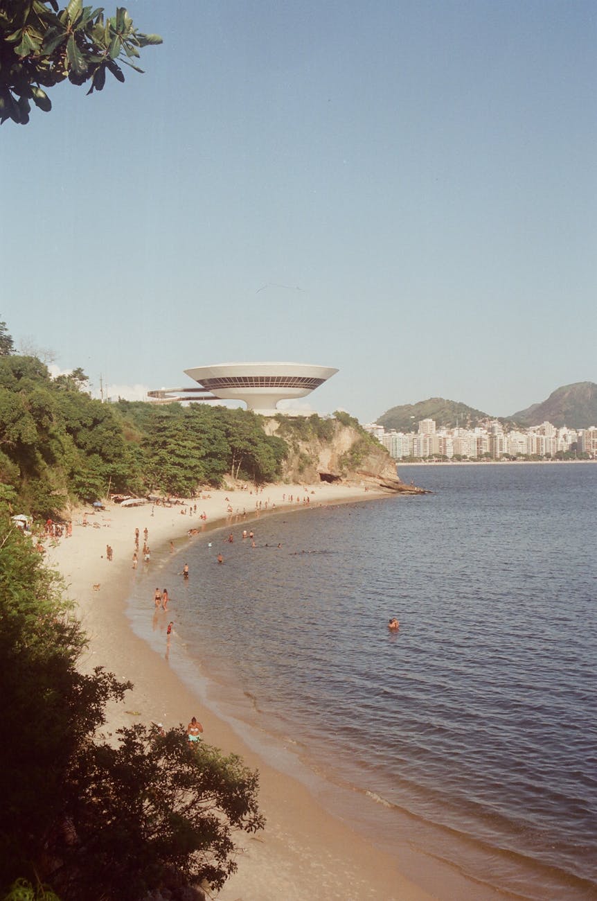 people at seashore in coastal town