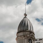 white concrete dome building under white clouds